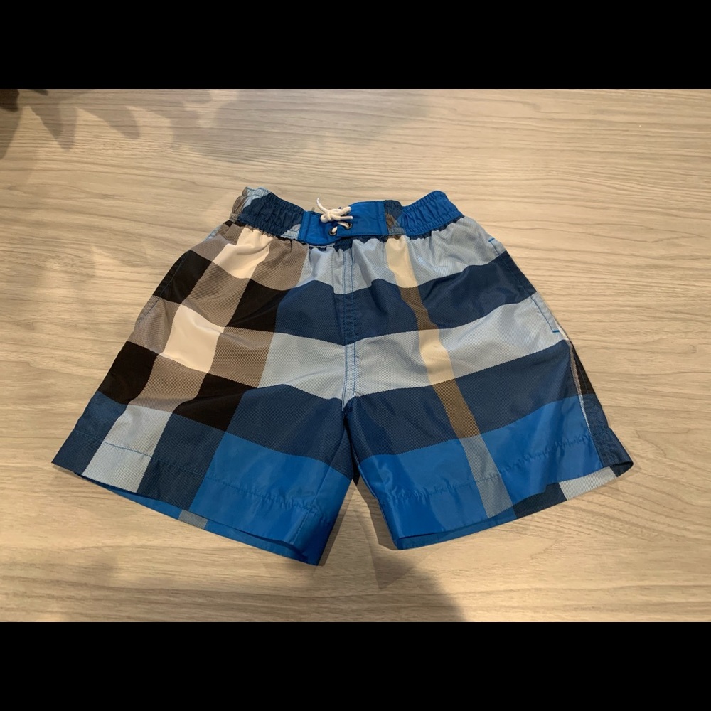 Burberry boys blue swim shorts size 4.
